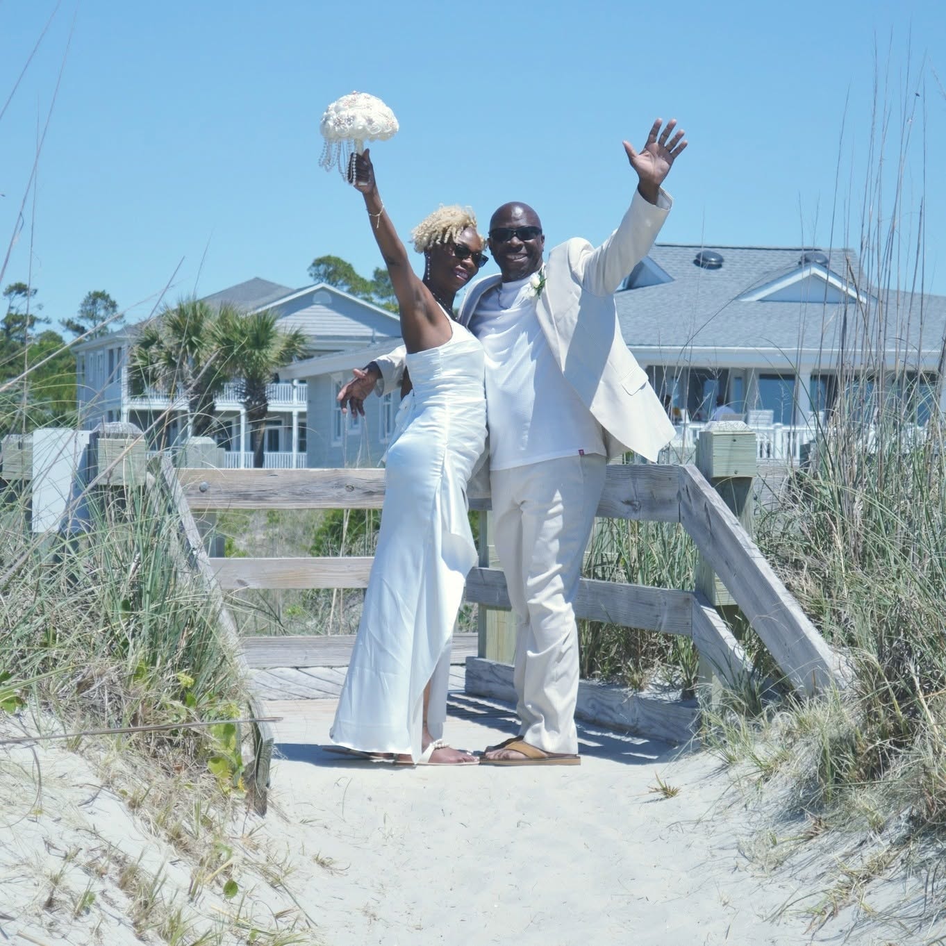 Couple celebrating on beach boardwalk