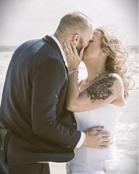 Couple kissing on the beach